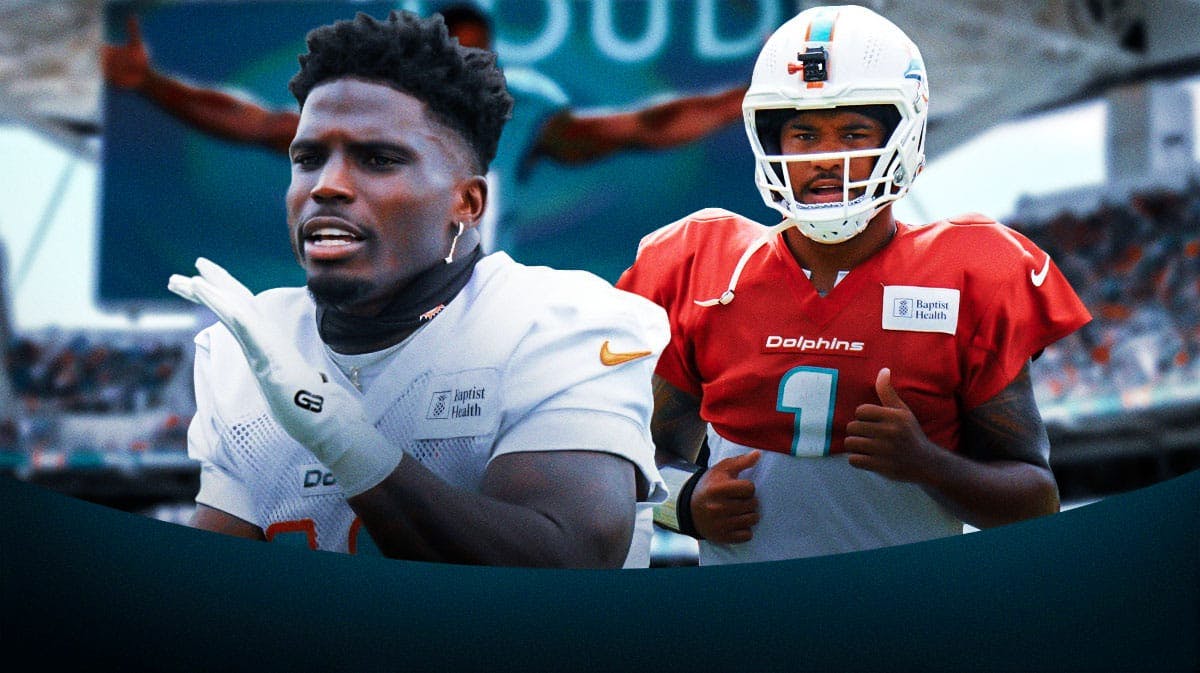 Miami Dolphins stars Tyreek Hill and Tua Tagovailoa in front of Hard Rock Stadium.