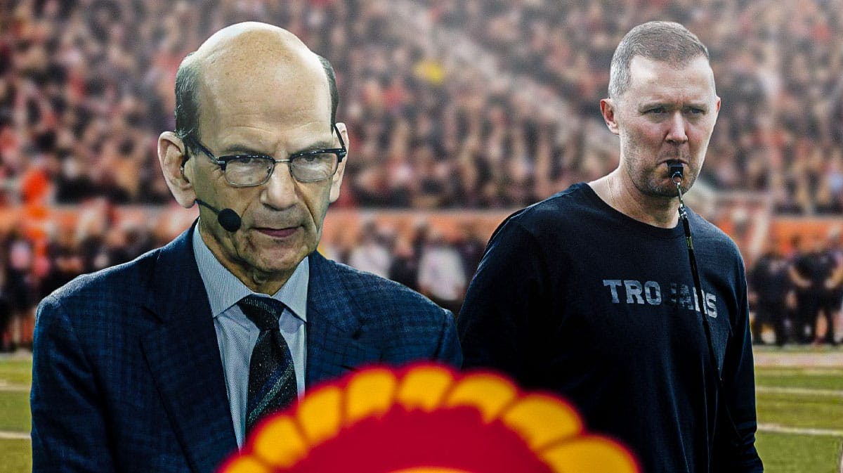 ESPN analyst Paul Finebaum on left side, USC Trojans Football head coach Lincoln Riley on right side, Los Angeles Memorial Coliseum (home stadium of the USC Trojans football team) in background