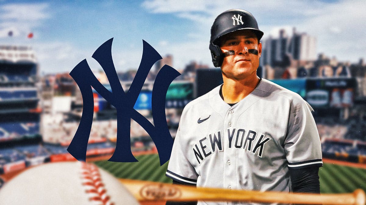 New York Yankees logo on left side, New York Yankees first baseman Anthony Rizzo on right side, Yankee Stadium (home stadium of the New York Yankees) in background.