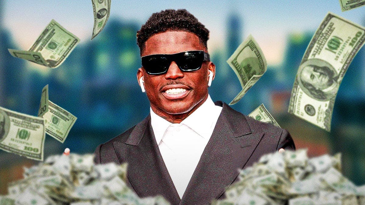 Tyreek Hill surrounded by piles of cash.