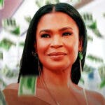 Nia Long surrounded by piles of cash.
