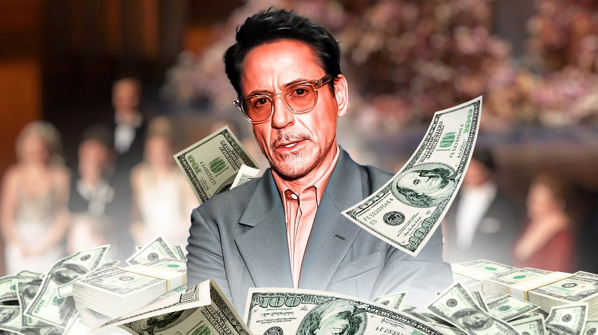 Robert Downey Jr. surrounded by piles of cash.