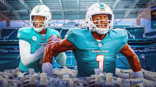 Tua Tagovailoa surrounded by piles of cash.