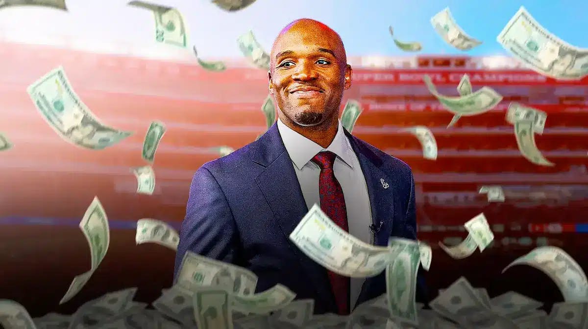 DeMeco Ryans surrounded by piles of cash.