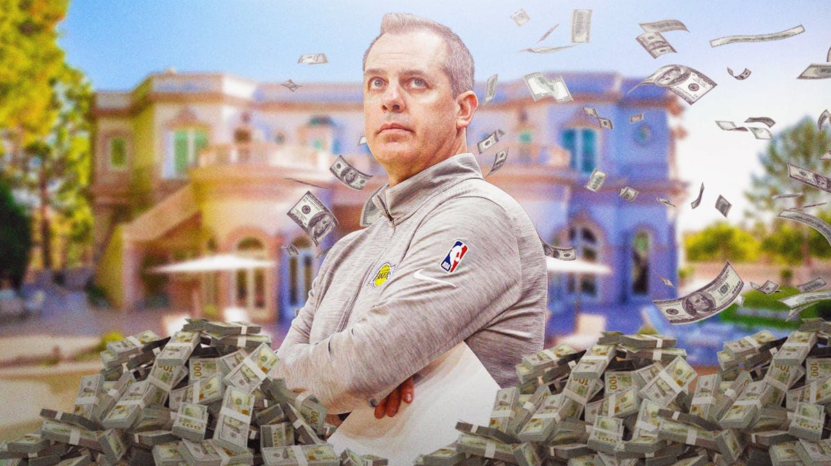 Frank Vogel surrounded by piles of cash.