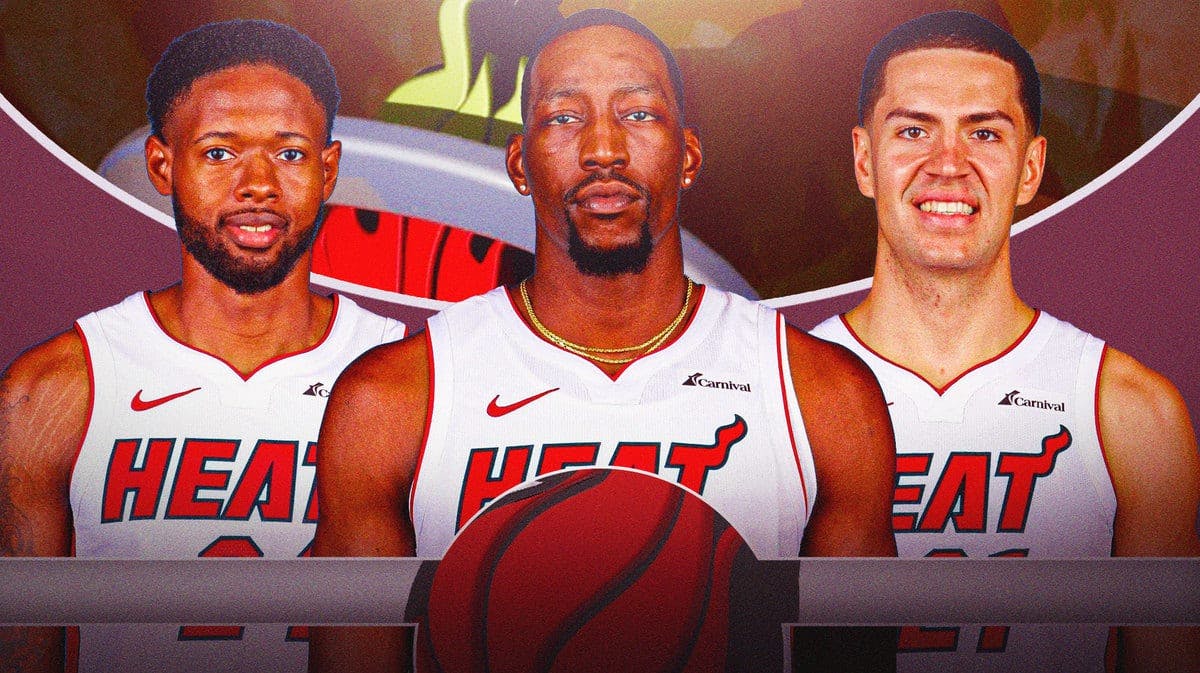 Bam Adebayo, Haywood Highsmith, and Cole Swider in front of the Miami Heat logo.