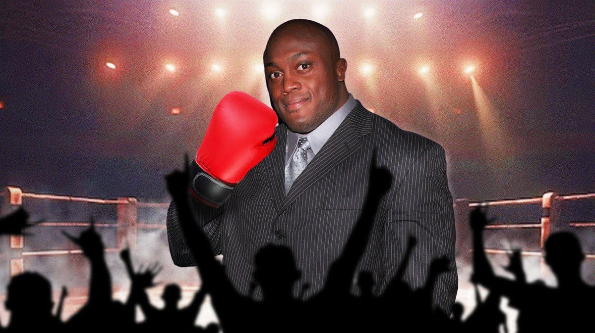 Bobby Lashley with red boxing gloves on his hands in a boxing ring.