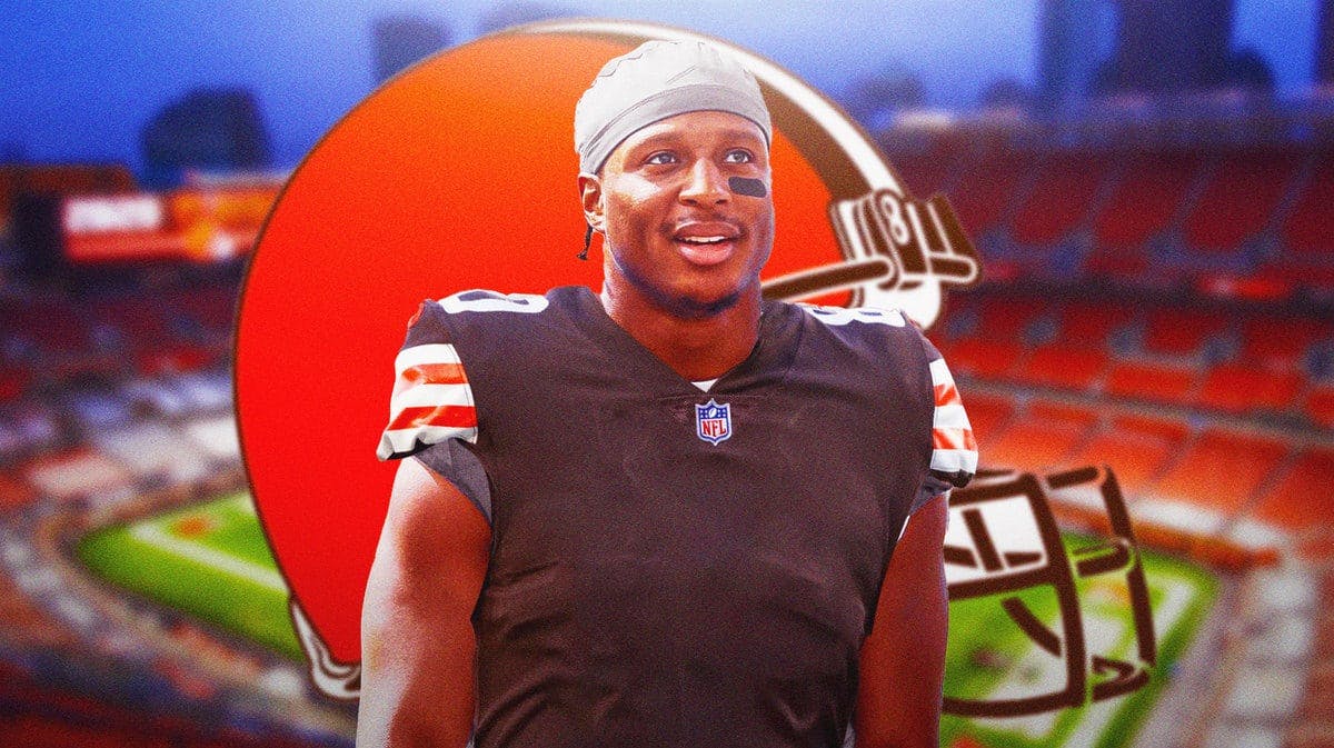 Running back Kenyan Drake is front of Cleveland Browns stadium in his new uniform.