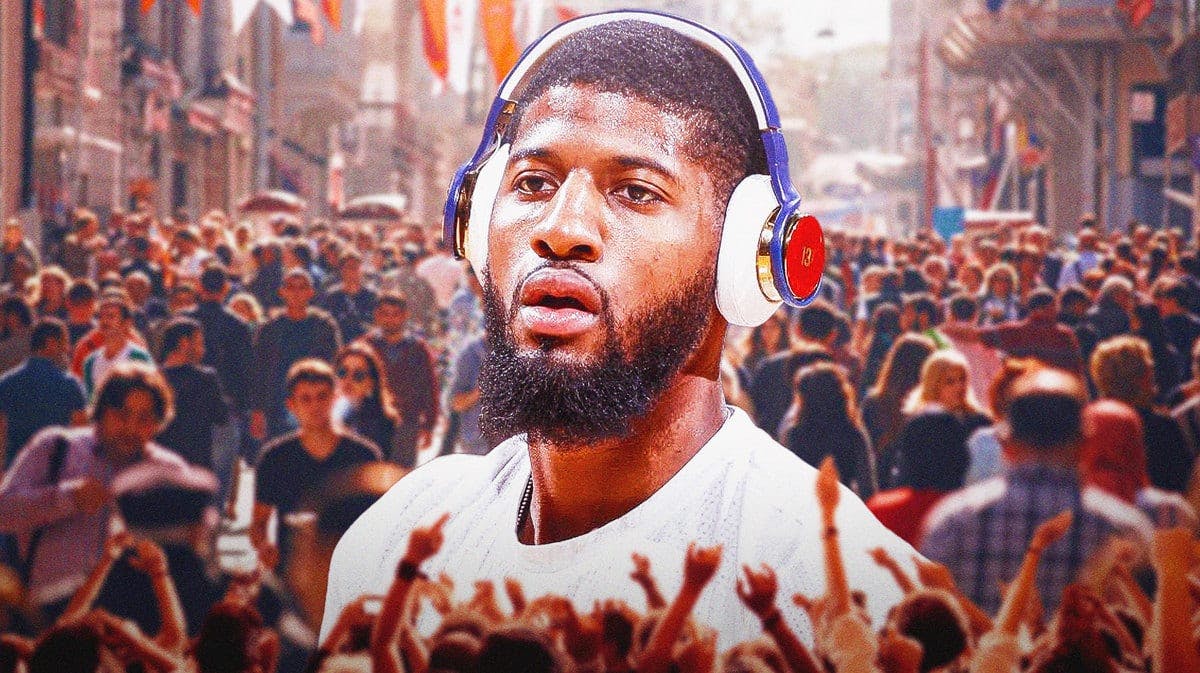 Clippers' Paul George in a crowded room wearing headphones.
