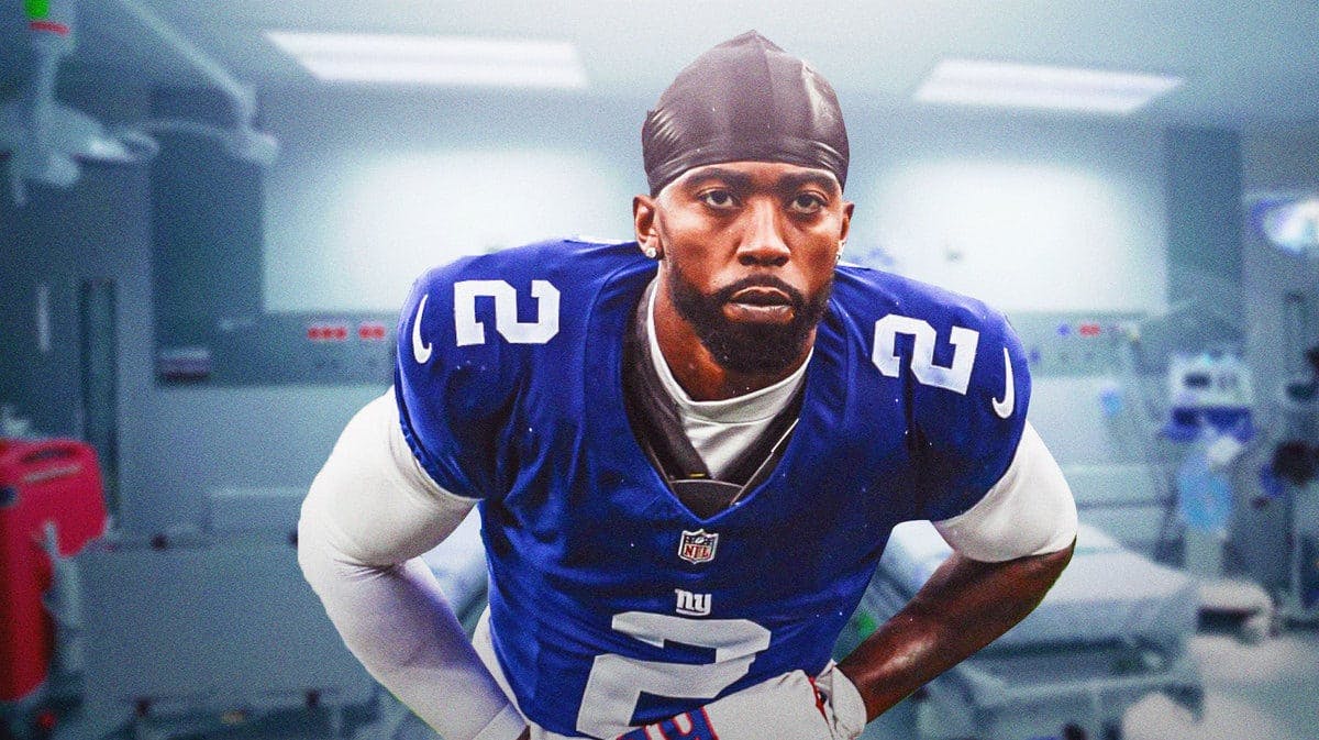 Tyrod Taylor in Giants jersey looking serious with a hospital as the background