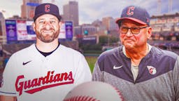 Stephen Vogt wearing a Cleveland Guardians hat at Progressive Field. Guardians' Terry Francona in background