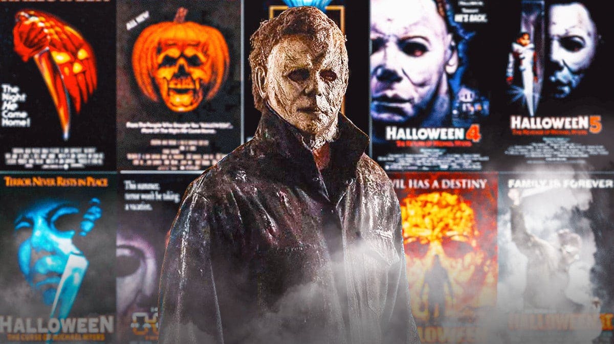 Michael Myers in front of all of the Halloween movie posters.