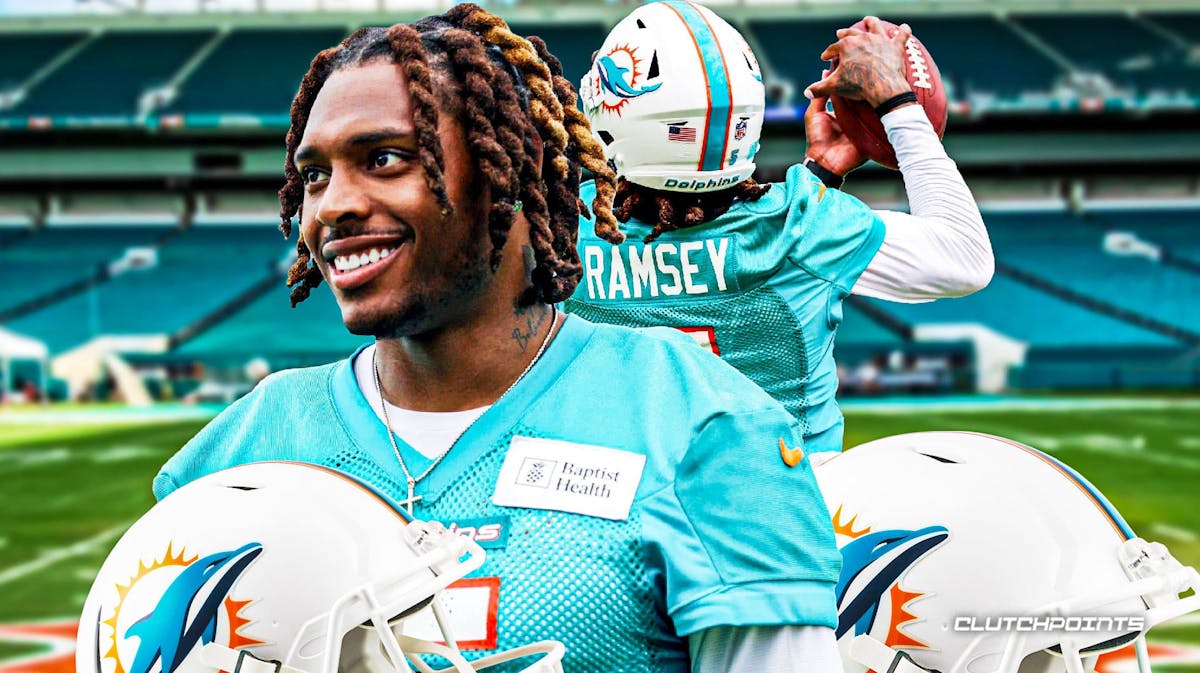 Jalen Ramsey smiling, making hand signals with Dolphins image in background.
