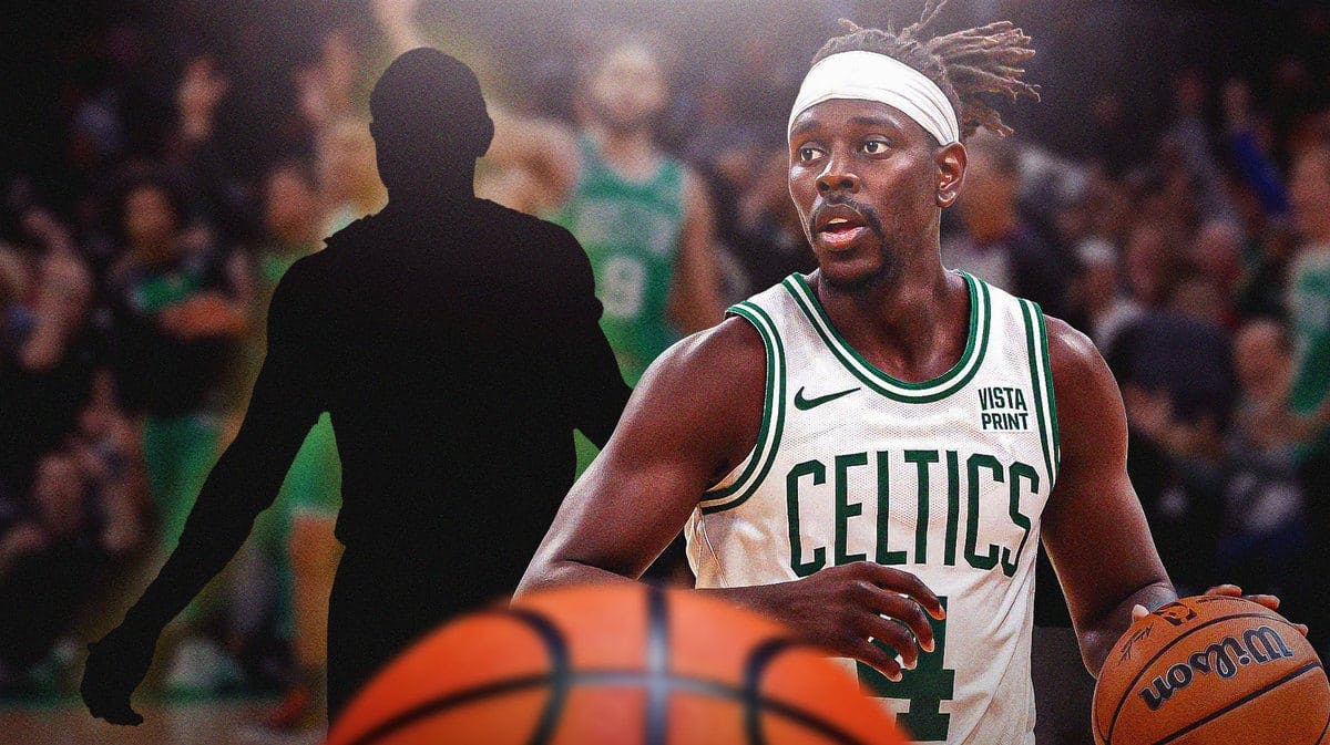 Boston Celtics PG Jrue Holiday looking at a blank silhouette.