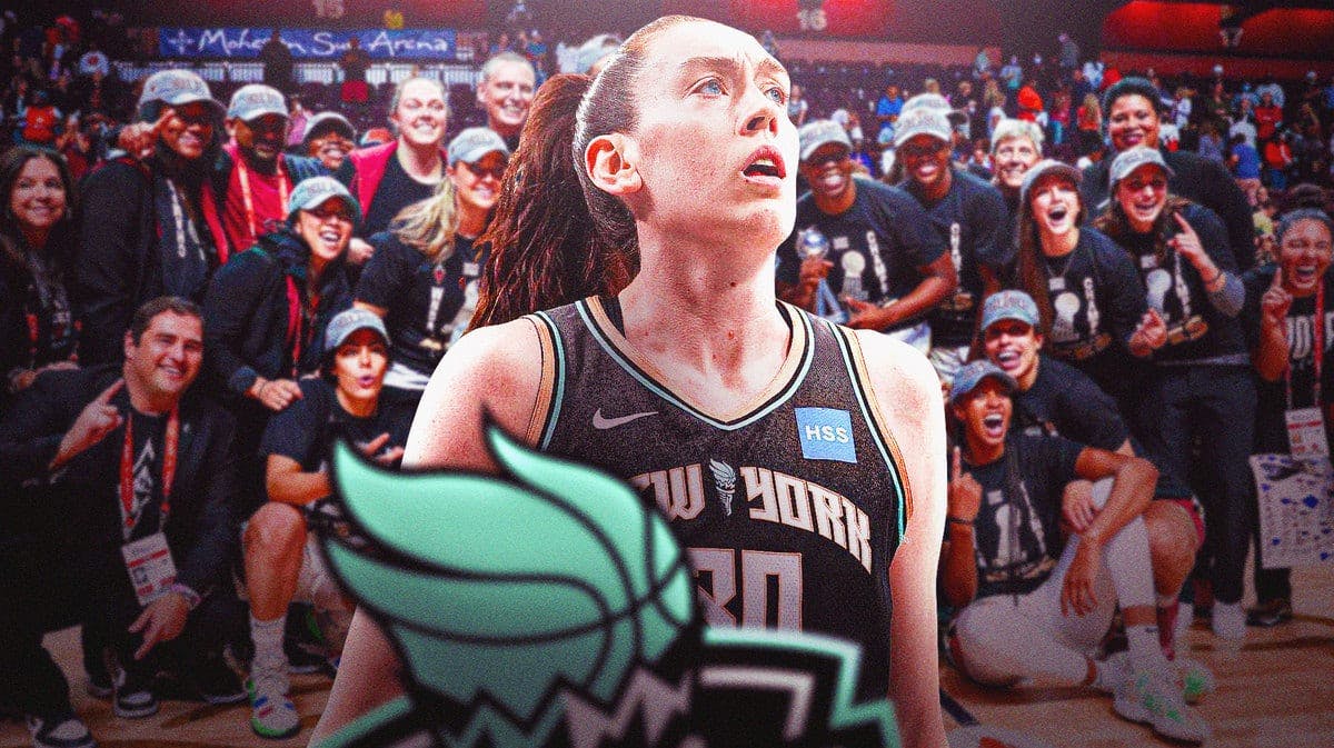 Breanna Stewart in a Liberty jersey, Aces players celebrating in the background