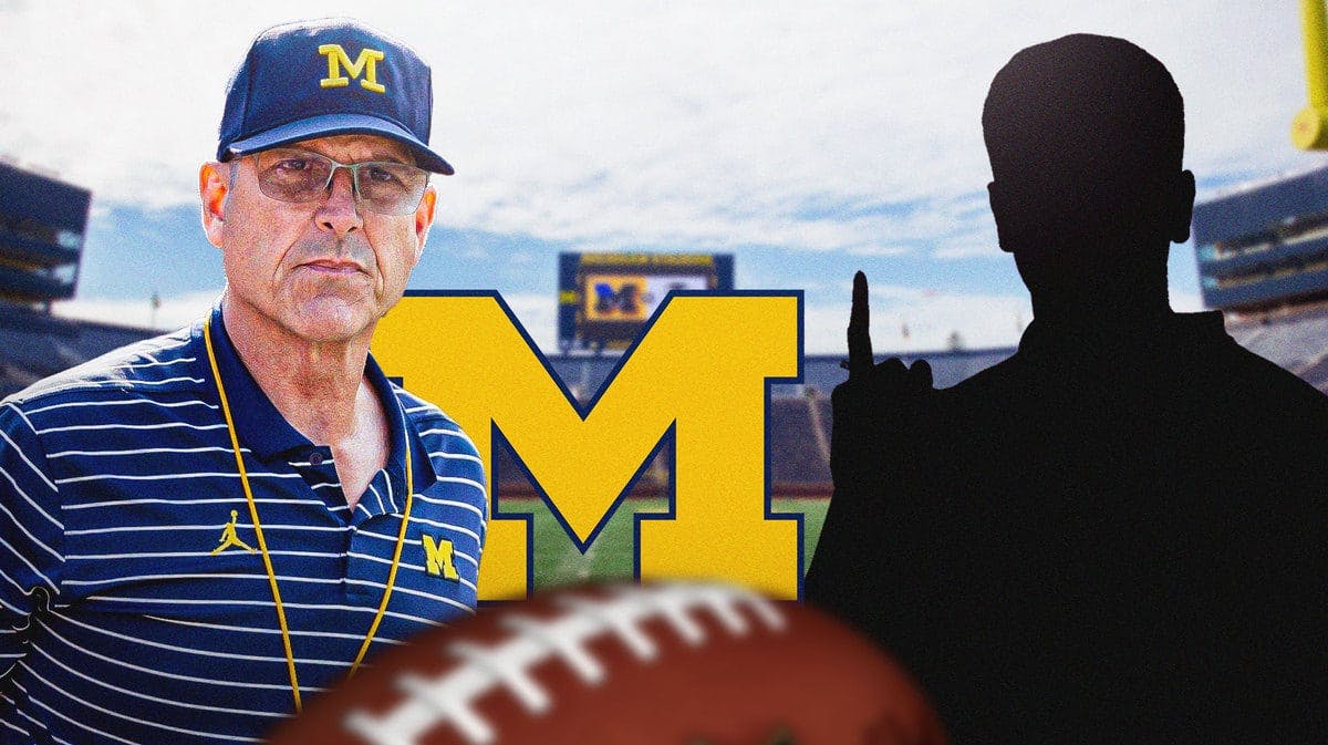 Jim Harbaugh looking serious with the Michigan football logo in the background