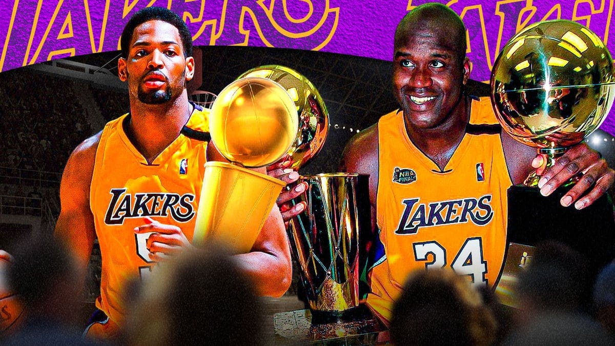 Robert Horry and Shaquille O’Neal, both in LA Lakers uniforms, both holding NBA championship trophy