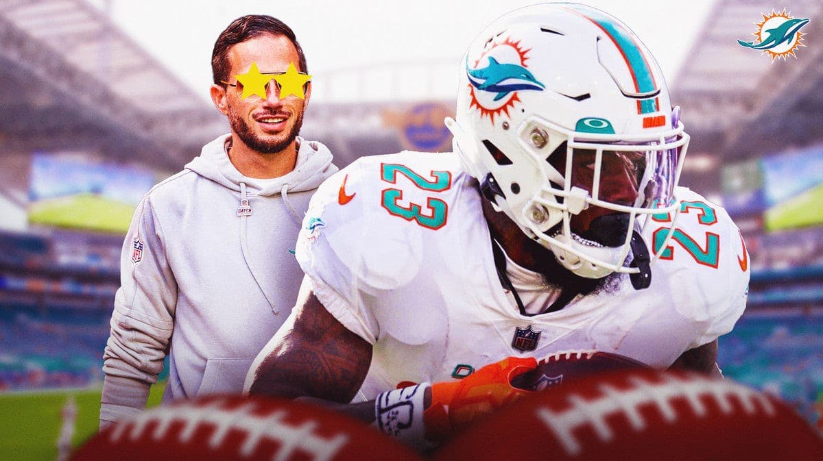 Dolphins coach Mike McDaniel looking at running back Jeff Wilson with stars in his eyes.