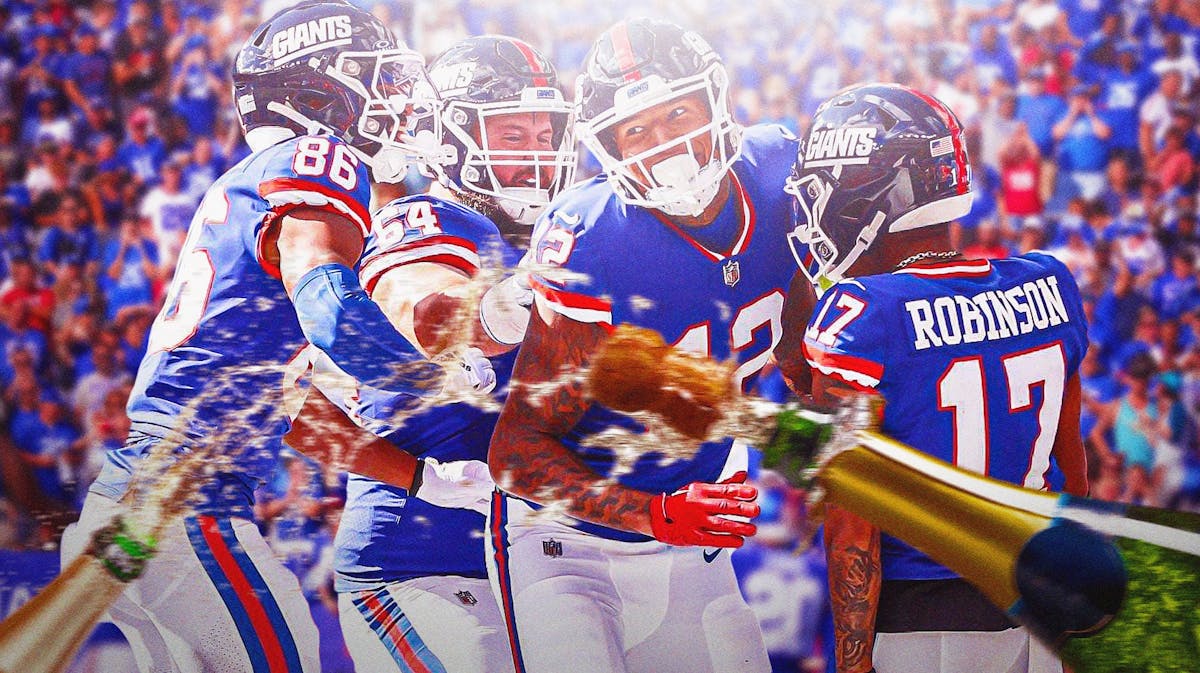 New York Giants players celebrating, with champagne bottles popping in the foreground.