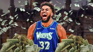 Karl-Anthony Towns surrounded by piles of cash.
