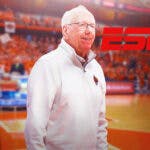 Syracuse Jim Boeheim looking happy next to ESPN logo. Background is Carrier Dome.