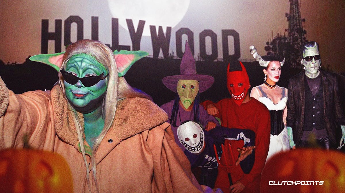 Halloween costumes with the Hollywood sign behind them.