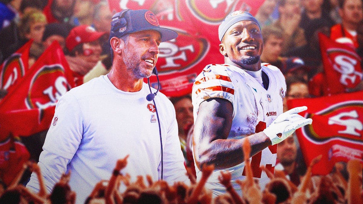 Photo: Deebo Samuel in 49ers uniform with Kyle Shanahan in 49ers gear smiling, and fans behind them
