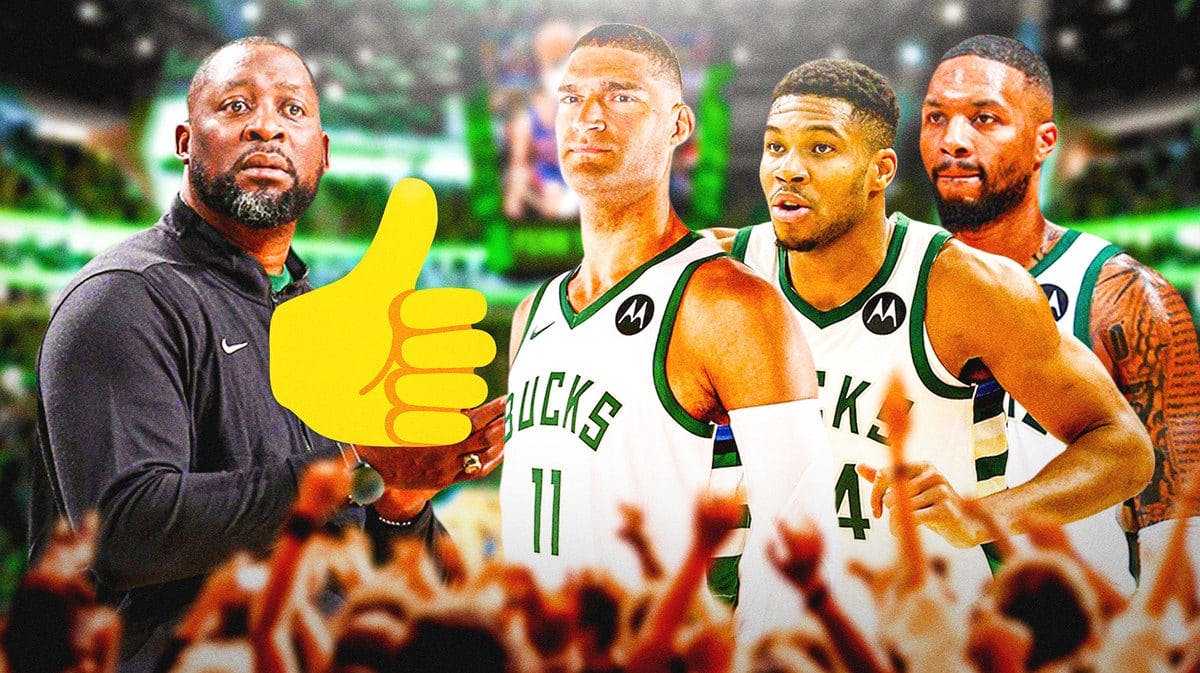 Thumb: Adrian Griffin giving the thumbs up to Brook Lopez, Bucks players.