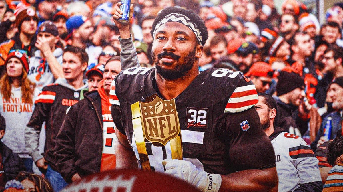 Photo: Myles Garrett with the DPOY award in Browns jersey and Browns fans cheering behind him