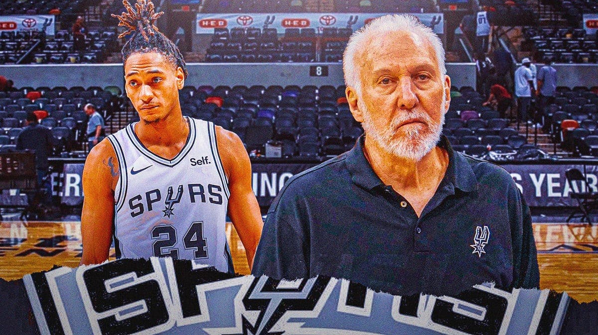 Spurs HC Gregg Popovich looking at Devin Vassell who has an injury.