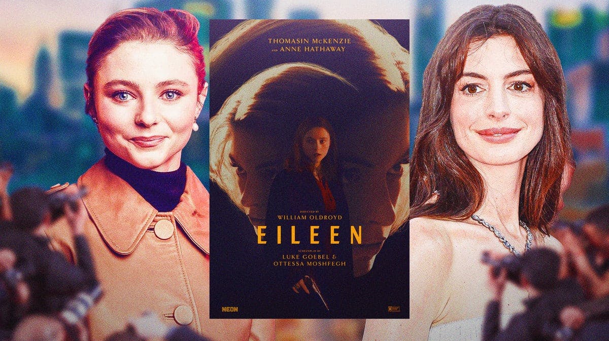 Thomasin McKenzie and Anne Hathaway between Eileen poster.