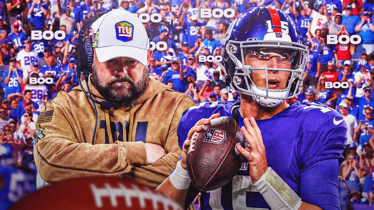 Photo: Tommy DeVito in Giants uniform with Brian Daboll in Giants gear, with fans booing them