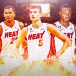 Miami Heat players Orlando Robinson, Nikola Jovic, and Jamal Cain in front of the Kaseya Center.