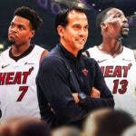 Miami Heat head coach Erik Spoelstra next to Kyle Lowry and Bam Adebayo.