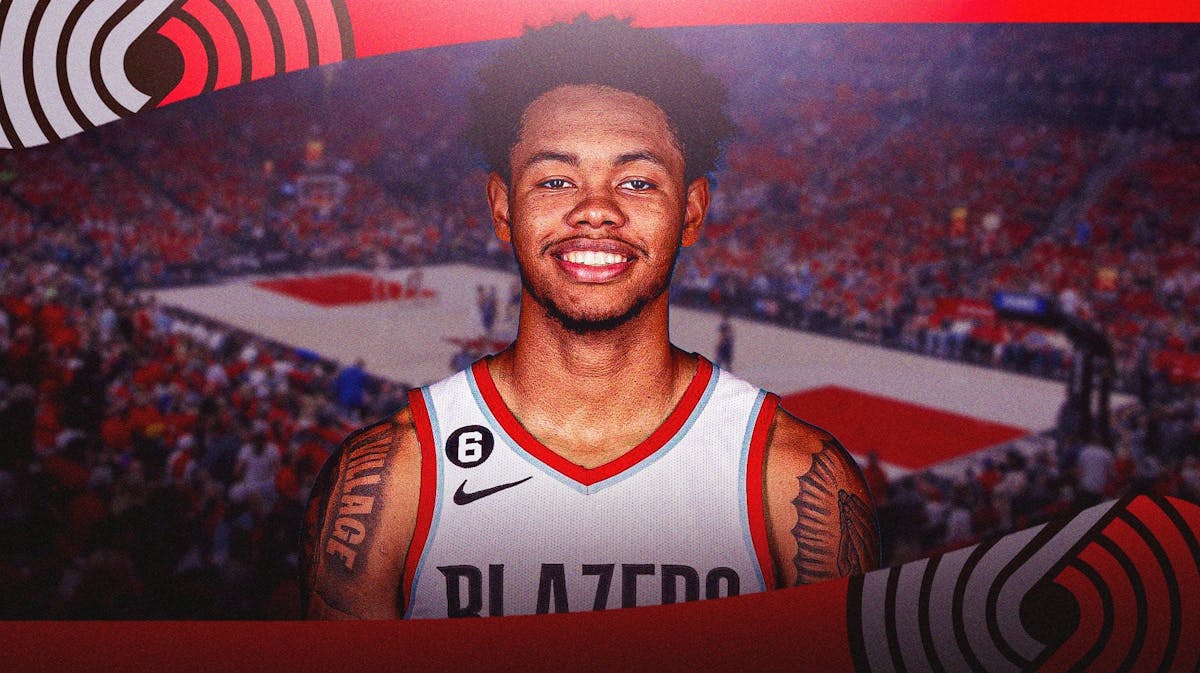 Anfernee Simons with the Blazers arena in the background injury