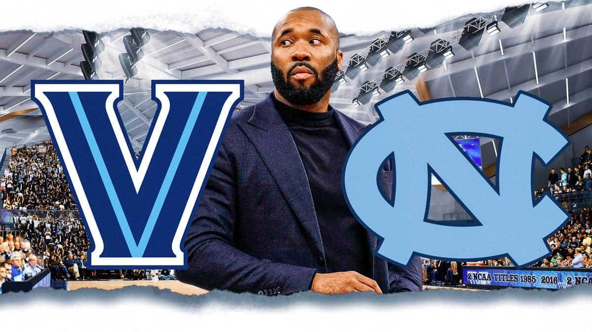 Kyle Neptune with both the Villanova and UNC logos in the background