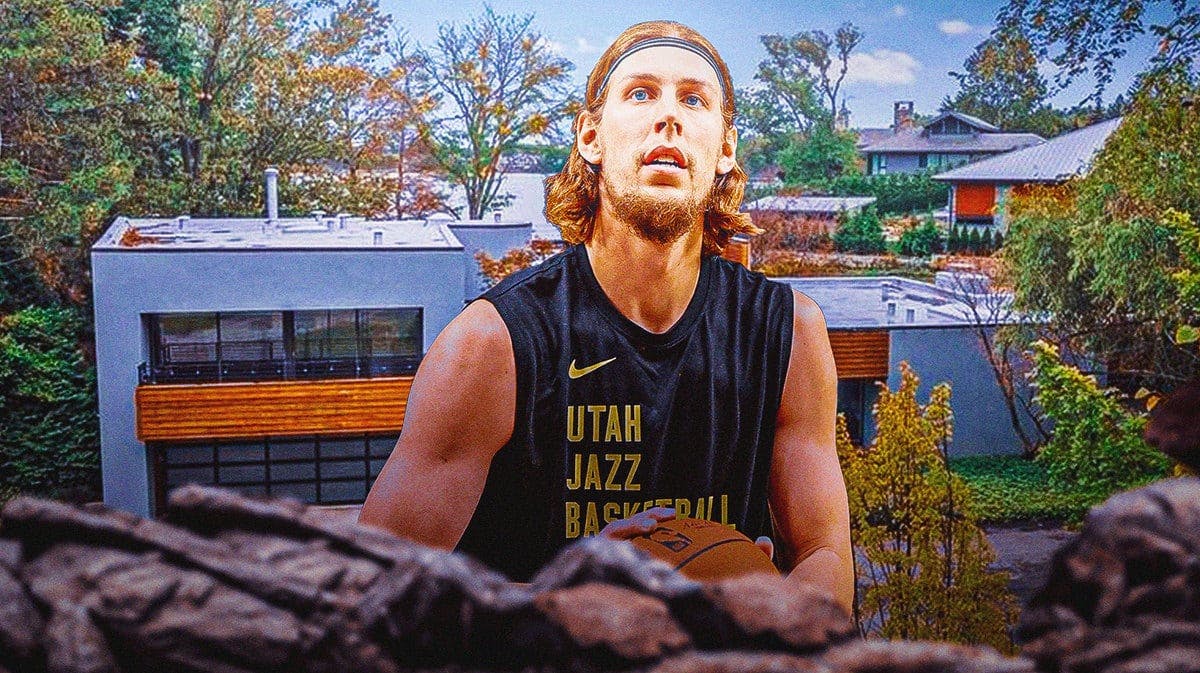 Kelly Olynyk in front of the home he is selling.