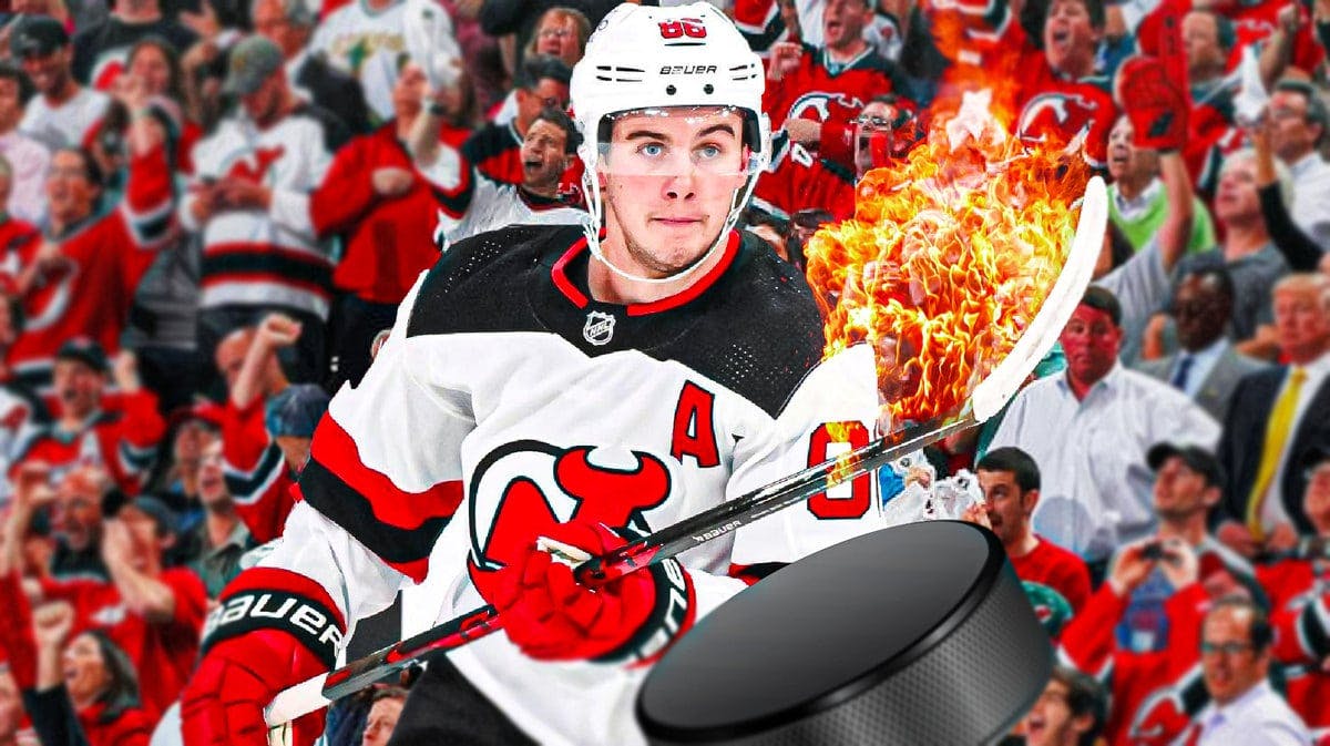 Jack Hughes with his stick on fire