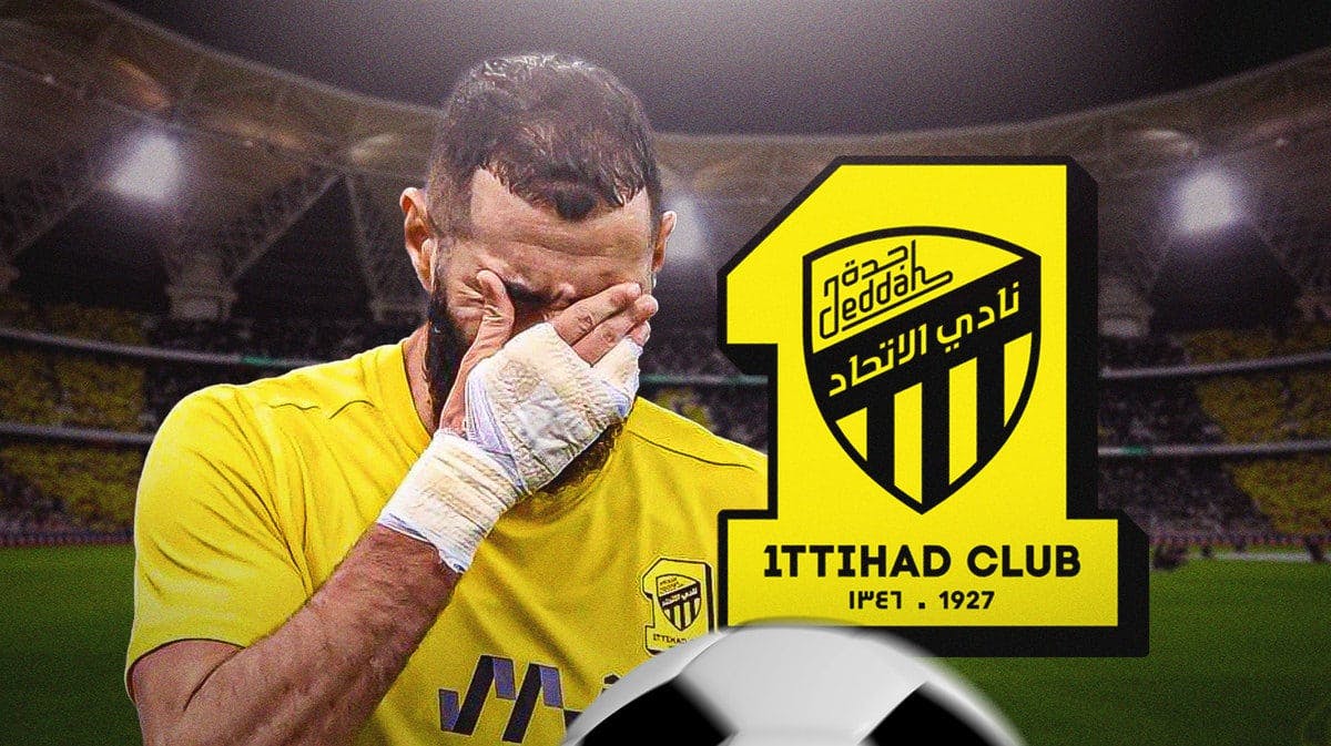 Karim Benzema sad/looking down in front of the AL-Ittihad logo