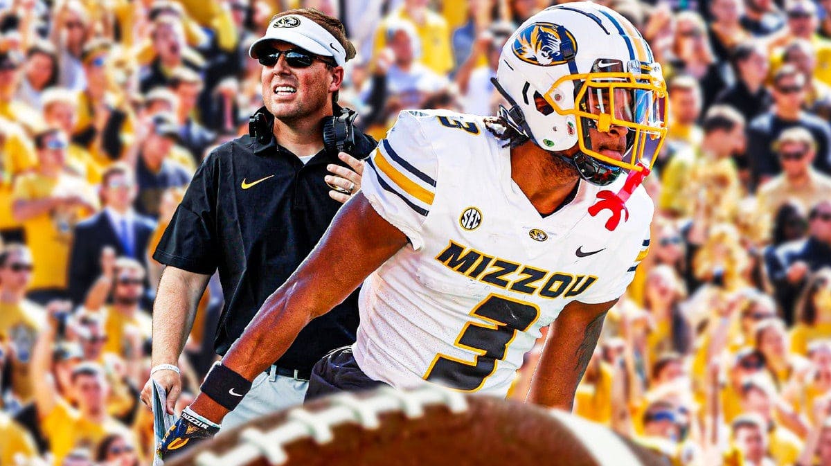 Photo: Luther Burden in Missouri football uniform, with head coach Eliah Drinkwitz and screaming fans behind them