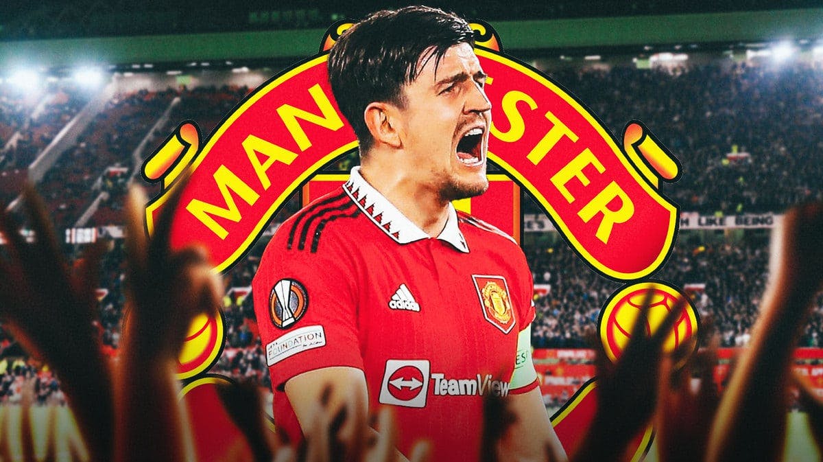 Harry Maguire shouting in front of the Manchester United logo