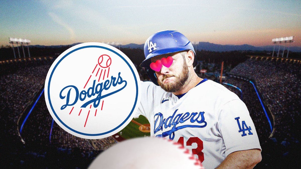 Dodgers' Max Muncy with hearts in his eyes looking at the Dodgers logo.
