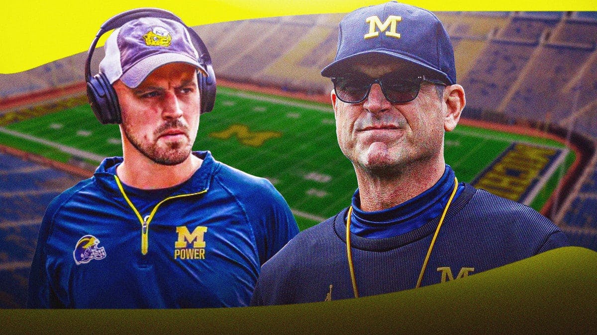 Connor Stalions looking serious, Jim Harbaugh beside him looking serious, both in Michigan gear