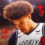 Nets' Cam Johnson with cross signs in the background