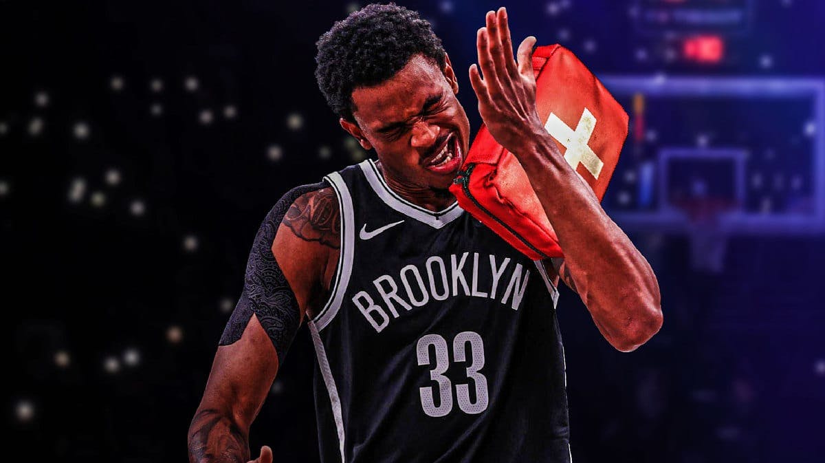 Nets' Nic Claxton holding a first aid kit amid injury