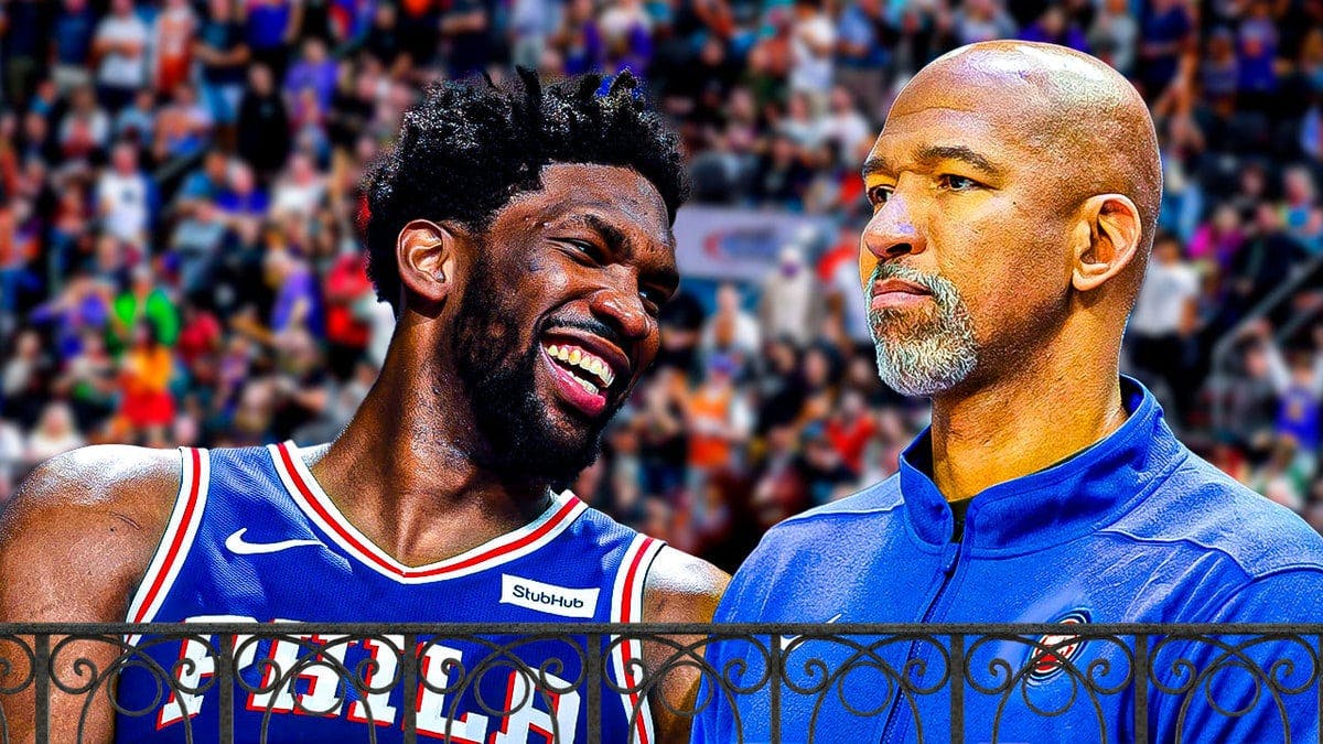 Pistons' Monty Williams looking angry, with Sixers' Joel Embiid laughing beside him