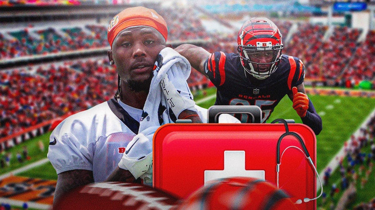 Tee Higgins with red medical + symbol next to him indicating an injury