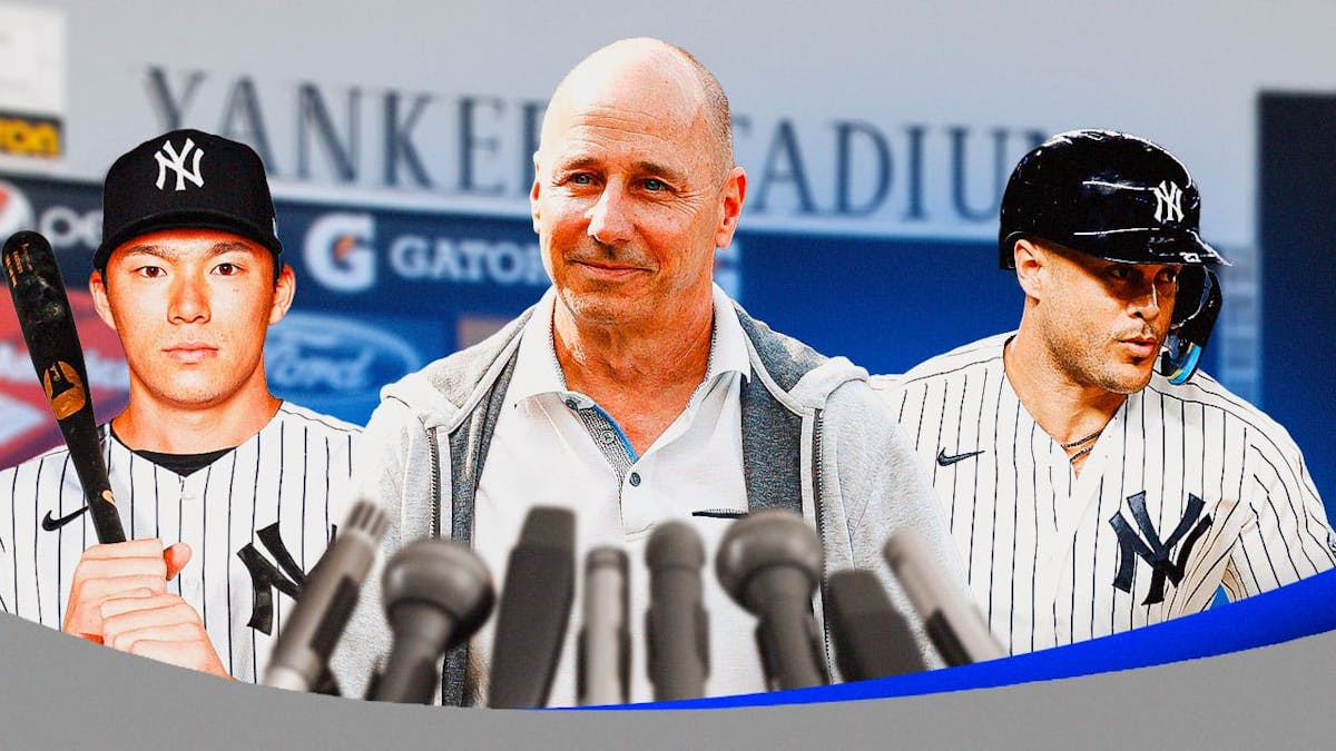 Yoshinobu Yamamoto, Brian Cashman, and Giancarlo Stanton in Yankees jerseys