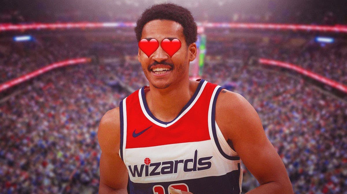 Jordan Poole in a Wizards jersey with hearts in his eyes