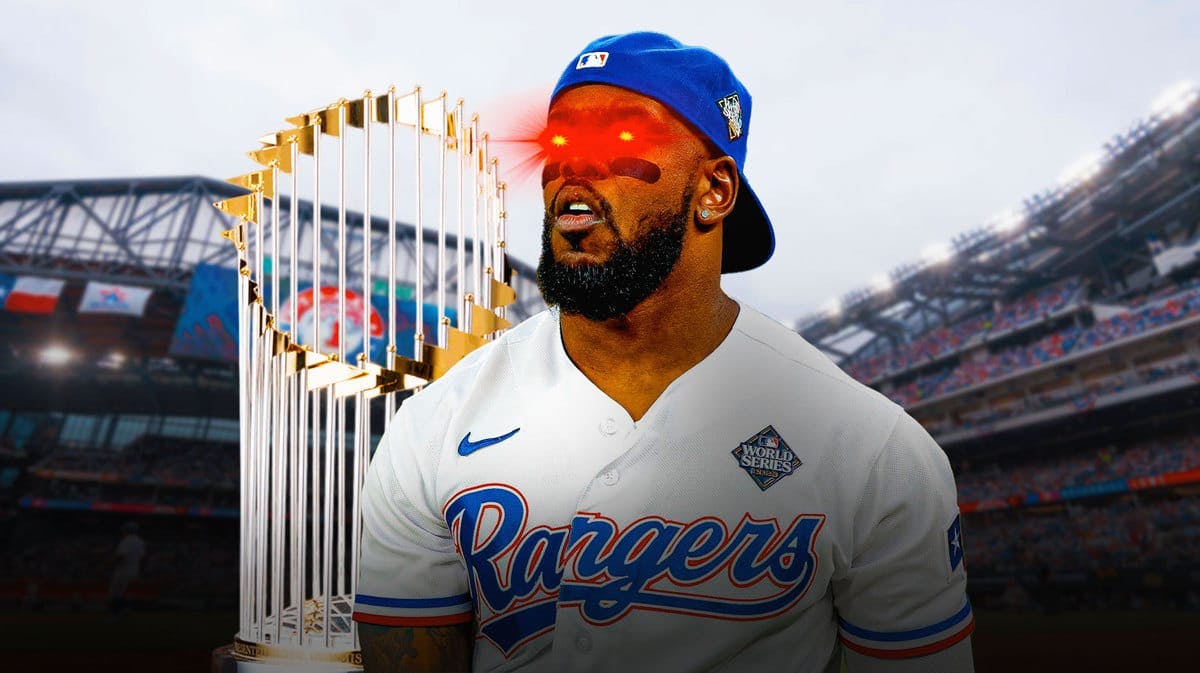 Adolis Garcia of the Rangers with woke eyes and with the World Series Trophy in the background